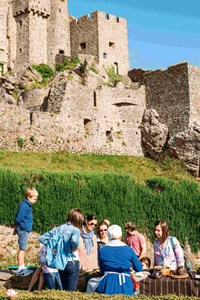 family looking up at mont orgueil jersey castle 