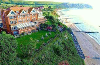 grand hotel in swanage on clifftop looking over blue sea